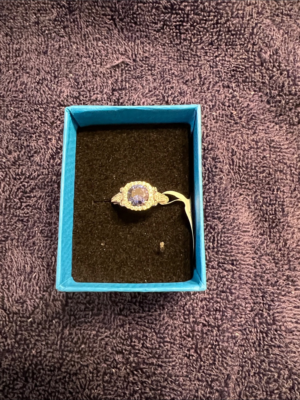 Silver Ring with Blue Gemstone and Halo Accent
